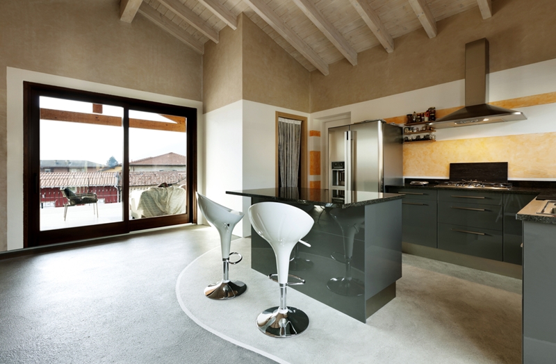 If you have the space, a kitchen island can offer a number of benefits to your room. 